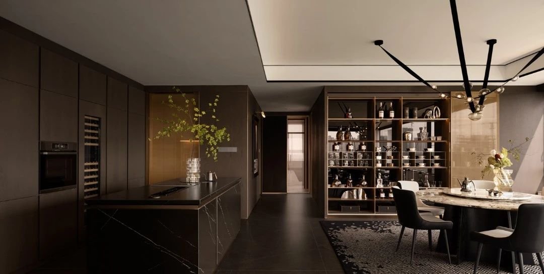 Dark-toned kitchen with a marble island, integrated wine storage and open display shelving beside the dining table